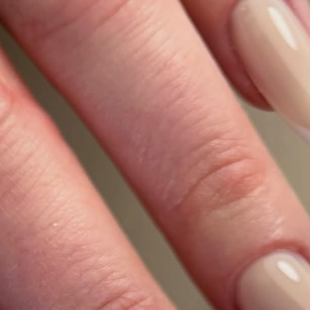 Clean nude manicure with a glossy finish