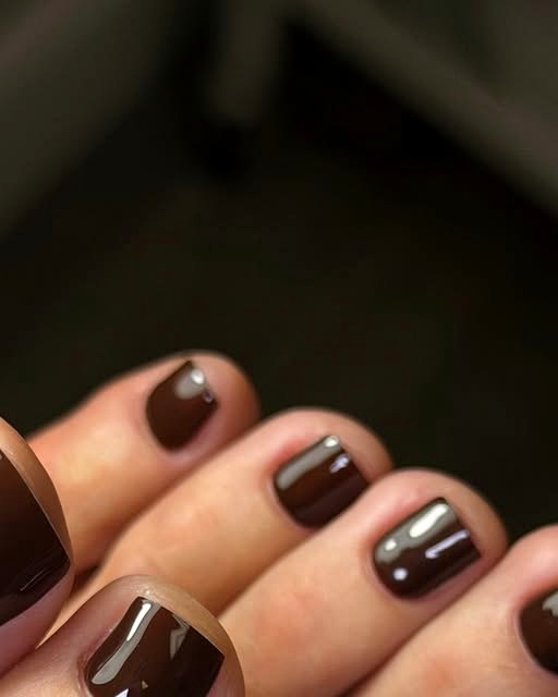 Chocolate brown pedicure with neat cuticles